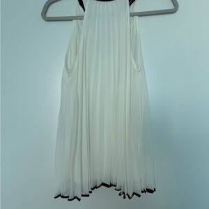 Elegant White Sleeveless Blouse with Black Accents